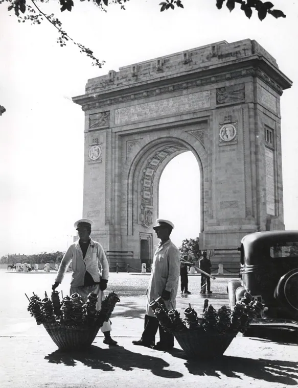 Pretzel vendors in uniform in front of the Arch of Triumph, Bucharest, interwar period